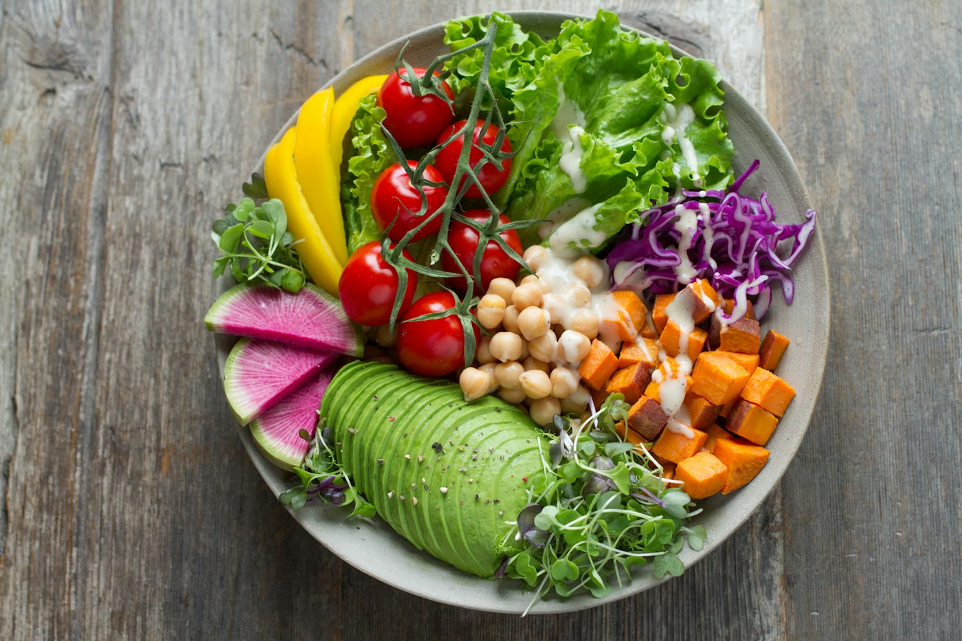 Colourful whole-food bowl with avocado, chickpeas and fresh vegetables
